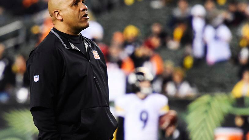 Cincinnati Bengals offensive coordinator Hue Jackson stand on the field prior to their18-16 loss to the Pittsburgh Steelers in the AFC wild card playoff game Saturday, Jan. 9 at Paul Brown Stadium in Cincinnati. NICK GRAHAM/STAFF