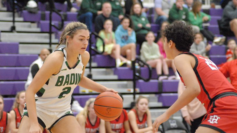 1.	Badin's Braelyn Even (2) is guarded by Indian Hill's Stella Bosley (24) during their Division II sectional final contest on Tuesday night at Middletown's Wade E. Miller Arena. Even scored a game-high 22 points. Chris Vogt/CONTRIBUTED