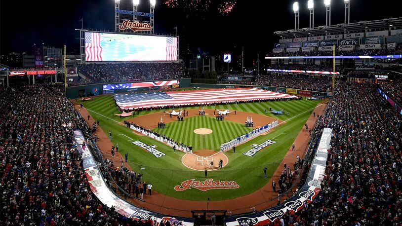 The Cleveland Indians and the Chicago Cubs stands during the national anthem prior to Game One of the 2016 World Series at Progressive Field on October 25, 2016 in Cleveland, Ohio.
