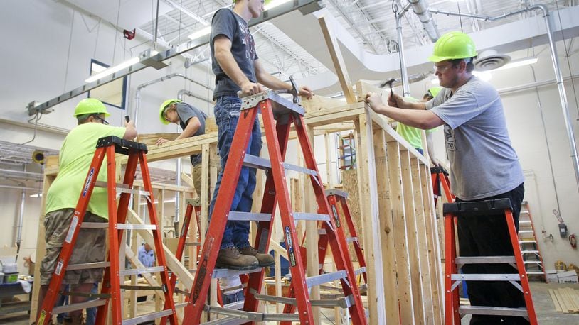 Students in the Hamilton High School Career Tech Ed program work on building a shed for one of the district’s elementary schools in 2013. Hamilton’s career education will merge at the end of the 2018-2019 school year with the much larger Butler Tech schools. GREG LYNCH/2013
