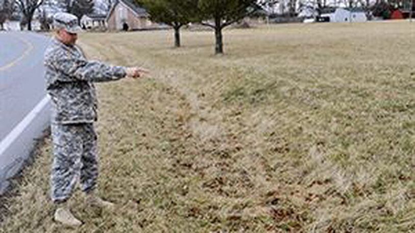 Ohio Army National Guard Sgt. 1st Class Chris Meinhardt, an 18-year veteran of the guard, shows where he found a lost young boy late last year. The boy had walked away from his grandmother’s house in Hamilton. NATIONAL GUARD PHOTO