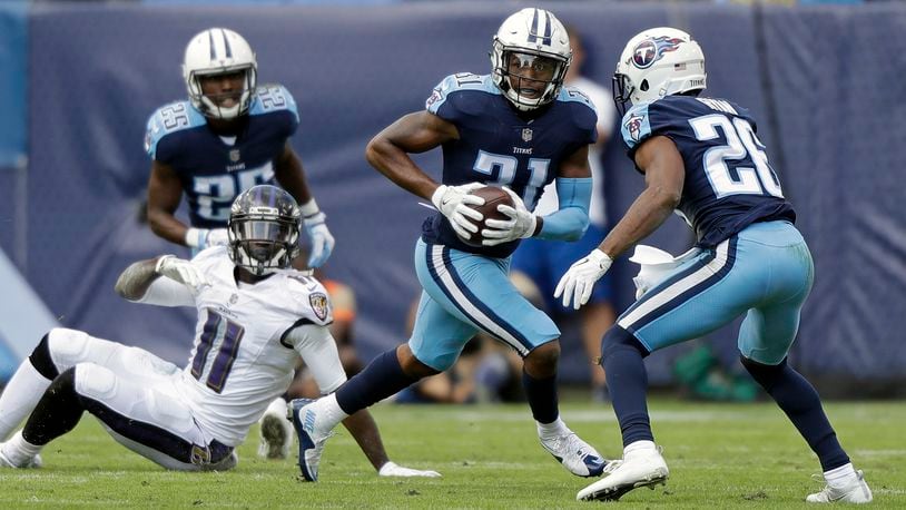 Tennessee Titans free safety Kevin Byard (31) intercepts a pass intended for Baltimore Ravens wide receiver Breshad Perriman (11) in the first half of an NFL football game Sunday, Nov. 5, 2017, in Nashville, Tenn. (AP Photo/Wade Payne)
