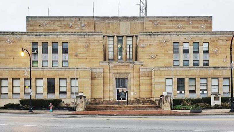 The former Hamilton municipal building at 20 High St. may be developed into 50 market-rate apartments by the developer who is creating The Marcum complex of apartments, restaurants and retail shops. NICK GRAHAM/STAFF