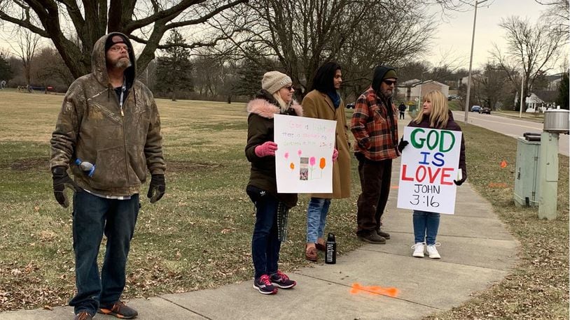 A group of Lebanon and Warren County residents expressed their opposition to the use of Donovan Elementary School for an After School Satan Club meeting on Jan. 27, 2022. No incidents were reported at the meeting or outside of the school. ED RICHTER/STAFF