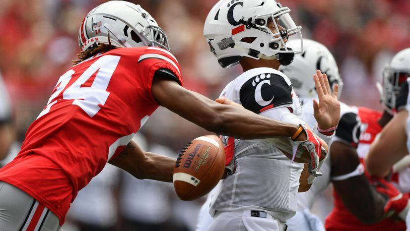 COLUMBUS, OH - SEPTEMBER 7: Quarterback Desmond Ridder #9 of the Cincinnati Bearcats is stripped of the ball by Shaun Wade #24 of the Ohio State Buckeyes as he attempts to pass in the second quarter at Ohio Stadium on September 7, 2019 in Columbus, Ohio. (Photo by Jamie Sabau/Getty Images)