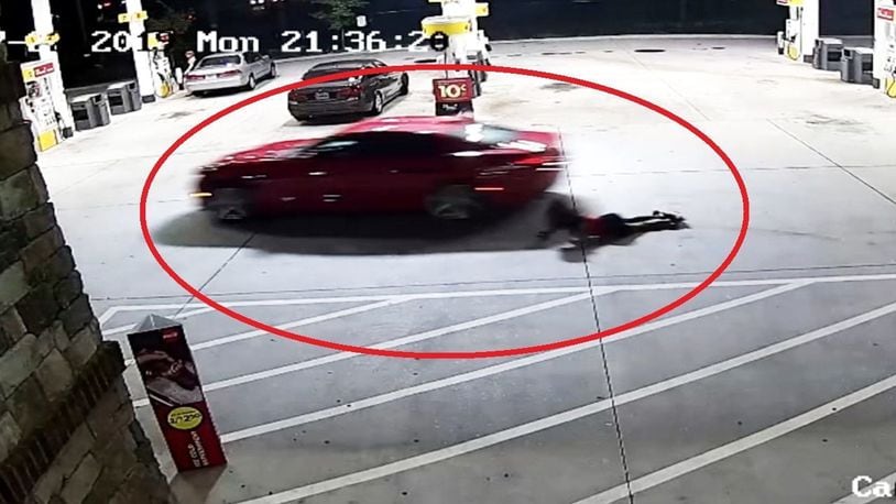 Pregnant woman dragged across parking lot as thief takes off in car.