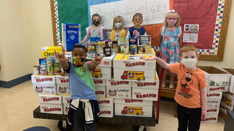 The annual food drive in Lakota Schools for Reach Out Lakota had to make some changes this year due to the coronavirus threat but officials say the turnout was still encouraging and the donations especially needed during the continued crisis. (Provided Photo\Journal-News)
