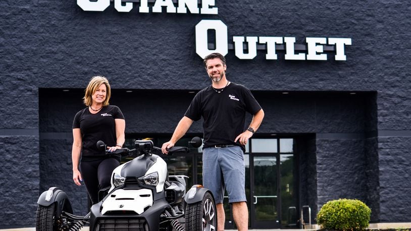 Owners Aaron and Bria Brown stand outside the new Octane Outlet of Middletown that has opened in the former Target store between Kohl's and Lowe's in Middletown. The motorcycle and powersports dealer more than tripled their floor space from their Middletown Cycle location on Commerce Drive. The 93,000-square-foot building features a wide variety of motorcycles, atvs, side-by-sides, watercraft, parts and accessories and a full service department. NICK GRAHAM / STAFF