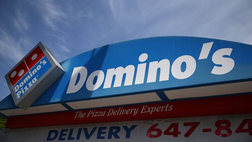 A sign is posted outside of a Domino's Pizza restaurant on May 1, 2014 in San Francisco, California. Authorities said a Domino's Pizza employee was fatally shot while making a delivery before midnight Saturday in Darlington, South Carolina.