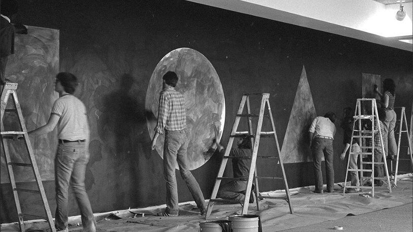Artists are pictured working on the original Sol LeWitt drawing at Wright State University in 1981. The drawings will be re-installed in February. They will demonstrate how the same idea can be executed in different ways. SUBMITTED PHOTO FROM LEWITT ARCHIVES