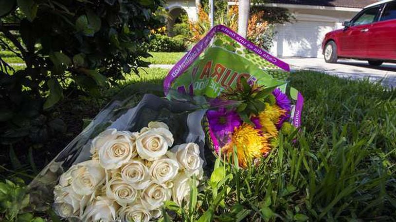 Flowers lie in front of John Stevens’ home on Southeast Kokomo Lane in Tequesta, Wednesday, August 17, 2016. Stevens and Michelle Mishcon were found dead after being attacked by Austin Harrouff Monday night at the home. The 19-year-old Florida State University sophomore fatally stabbed the two while walking home, authorities said. (Lannis Waters / The Palm Beach Post)