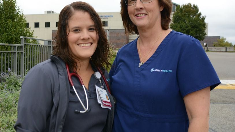 Amber Preston, a respiration therapist at Mercy Hospital-Fairfield, (left) and Kathy Harvey, a registered nurse at Mercy Hospital-Fairfield, saved the life of Steve Moore, a Fairfield resident who collapsed outside the Mercy HealthPlex on the Fairfield hospital’s Mack Road campus. MICHAEL D. PITMAN/STAFF