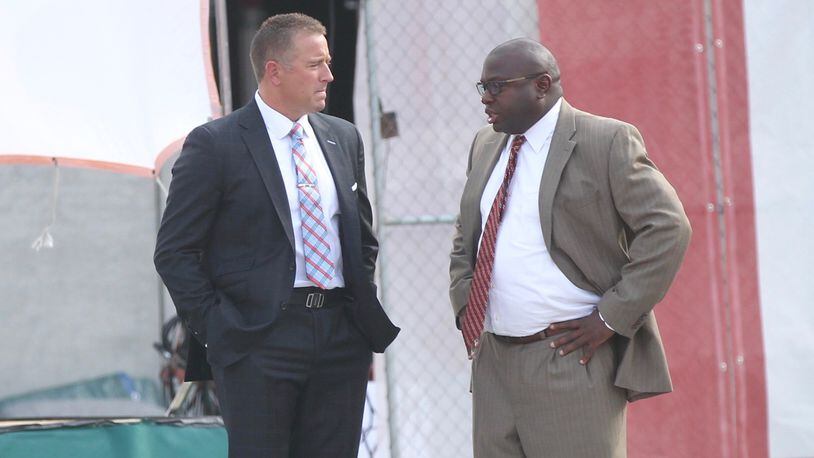 ESPN’s Kirk Herbstreit talks to Ohio State running backs coach Tony Alford before a game against Indiana on Aug. 31, 2017, at Memorial Stadium in Bloomington, Ind.