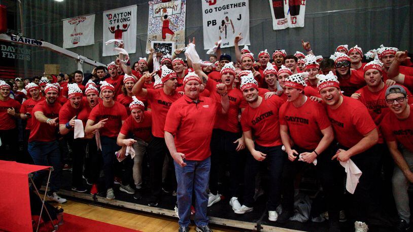 Dayton football coach Rick Chamberlin poses for a photo with his team during ESPN’s College GameDay at the Frericks Center in Dayton on Saturday, March 7, 2020. David Jablonski/Staff