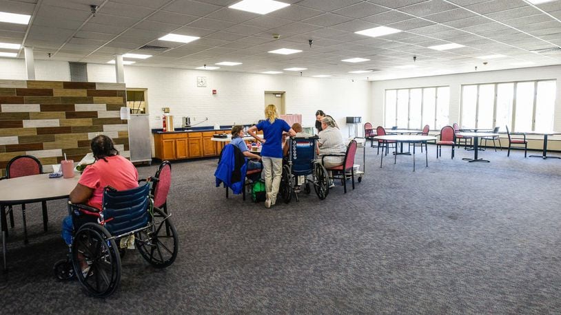 Residents play games in the partially renovated dining area at the Butler County Care Facility Tuesday, April 25 in Hamilton. NICK GRAHAM/STAFF