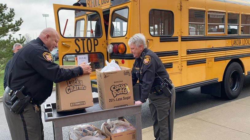 School resource officers from the Butler County Sheriff’s Office are helping out with the Lakota school district child nutrition department preparing and distributing meals during the coronavirus pandemic. SUBMITTED