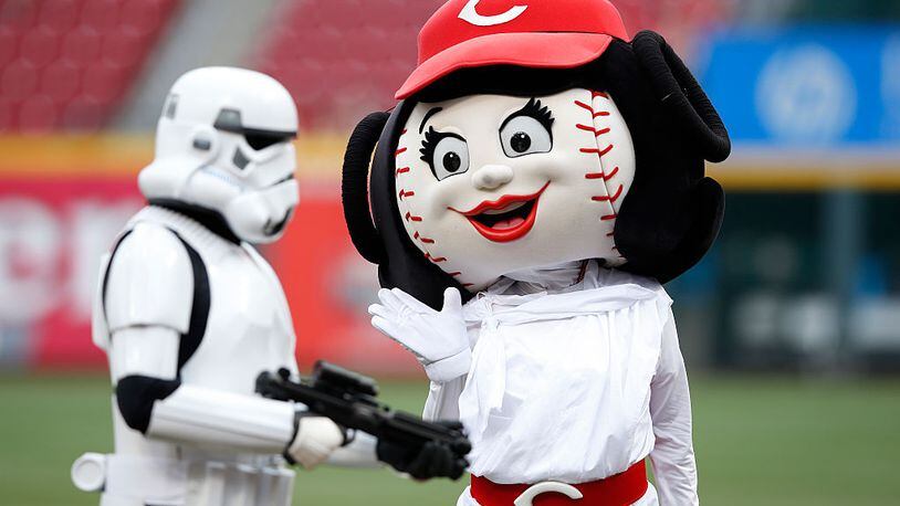 CINCINNATI, OH - MAY 15: Cincinnati Reds mascot Rosie Red waves to a Star Wars character on the field before the game against the San Francisco Giants at Great American Ball Park on May 15, 2015 in Cincinnati, Ohio. (Photo by Joe Robbins/Getty Images)