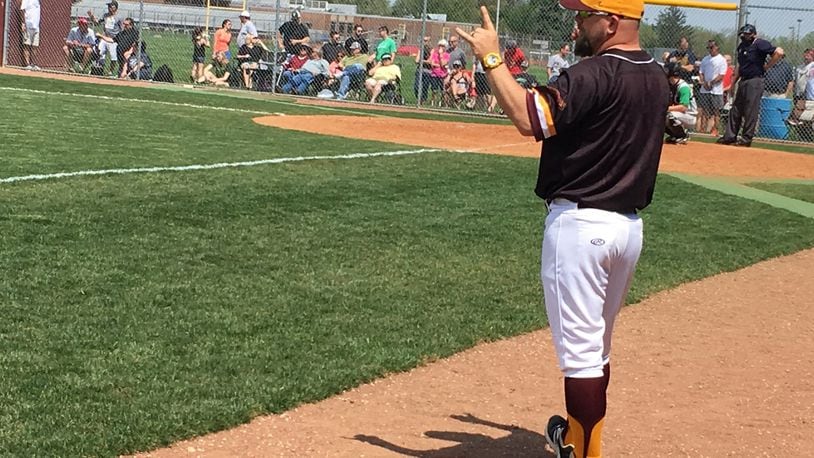 Ross coach Jason Rettinger works from the third-base coaching box during Sunday afternoon’s 5-4 victory over visiting Badin. RICK CASSANO/STAFF