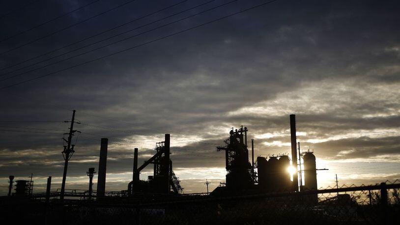 The silhouette of idle blast furnaces are seen during sunrise at the U.S. Steel Corp. Granite City Works facility in Granite City, Ill., on Wednesday, Oct. 25, 2017. U.S. Steel Corp. announced Wednesday, Dec. 18, 2019, operations at its Great Lakes Works facility near Detroit, Mich., will cease by the close of 2020.
