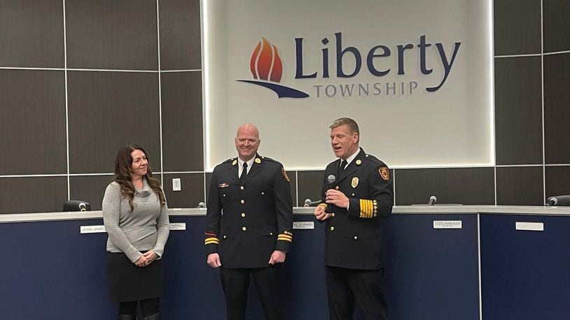The latest symbol of Liberty Twp.’s maturation as one of the region’s fastest growing communities was recently pinned onto the chest of Fire Department Lt. Matthew Owen. Late last month, Owen took part in a ceremony during a Liberty Twp. Trustees’ meeting where he was announced as the township’s first fire marshal. Owen was joined by his wife Kelly as Liberty Twp. Fire Chief Ethan Klussman (right) conducted the pinning ceremony. (Provided Photo\Journal-News)