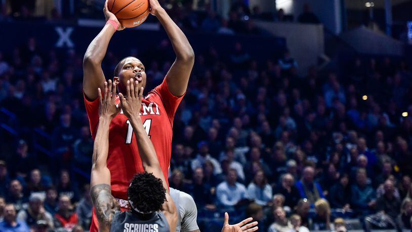 Miami’s Bam Bowman puts up a shot over Xavier’s Paul Scruggs during their basketball game Wednesday, Nov. 28, 2018, at Xavier’s Cintas Center in Cincinnati. Bowman scored 23 points Saturday in Miami’s win over Ohio. NICK GRAHAM/STAFF