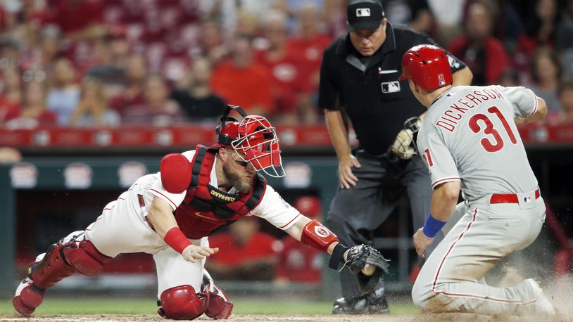 CINCINNATI, OH - SEPTEMBER 03: Corey Dickerson #31 of the Philadelphia Phillies scores a run ahead of the tag by Tucker Barnhart #16 of the Cincinnati Reds after a single by Bryce Harper in the fifth inning at Great American Ball Park on September 3, 2019 in Cincinnati, Ohio. The Phillies defeated the Reds 6-2. (Photo by Joe Robbins/Getty Images)
