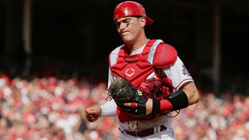 Reds catcher Tyler Stephenson reacts to a play during a game against the Guardians on Opening Day on Tuesday, April 12, 2022, at Great American Ball Park in Cincinnati. David Jablonski/Staff