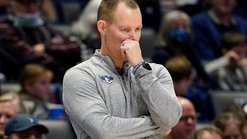 Xavier coach Travis Steele stands next to the home bench during the second half of an NCAA college basketball game against DePaul, Saturday, Feb. 5, 2022, in Cincinnati. (AP Photo/Jeff Dean)