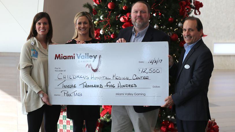 Miami Valley Gaming raised $12,500 in December with a charity pull tab promotion that benefited Cincinnati Children’s Hospital Medical Center. MVG President and General Manager Domenic Mancini (far right) and MVG Director of Marketing Jerry Abner presented the check to Cincinnati Children’s Donor Relations Officer Jane Livingston and Cincinnati Children’s Director of Special Events, Stewardship and Corporate Relations Kerri Finke.