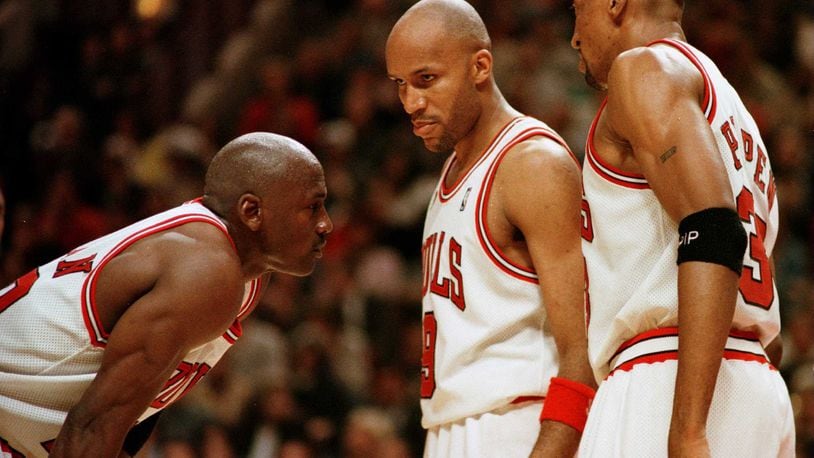 7 Jun 1996:  Michael Jordan of the  Chicago Bull, left, discusses strategy with teammates Ron Harper, center, and Scottie Pippen during a time-out on the court during the fourth quarter of game two in the NBA Finals at the United Center in Chicago, Illino