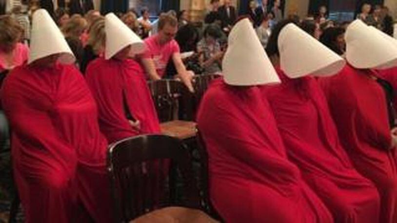 Women dressed in costume from The Handmaid s Tale protested a new bill in the Ohio Senate that would outlaw the most common surgery used in second trimester abortions. Photo by Jo Ingles/Statehouse News Bureau