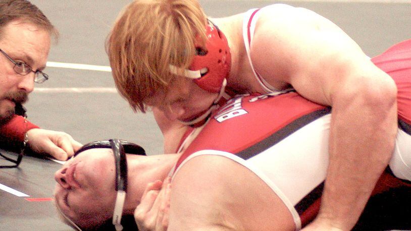 Madison’s Gunnar Dawson (top) gets backpoints against MIlton-Union’s Caleb Black during their 170-pound final match at the Southwestern Buckeye League tournament Saturday at Madison. Dawson claimed the title with a 18-6 major decision. CONTRIBUTED PHOTO BY JOHN CUMMINGS