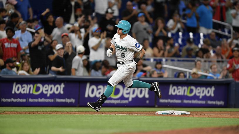 Miami Marlins' Peyton Burdick rounds third base after hitting a home run against the Cincinnati Reds during the sixth inning of a baseball game Friday, May 12, 2023, in Miami. (AP Photo/Michael Laughlin)