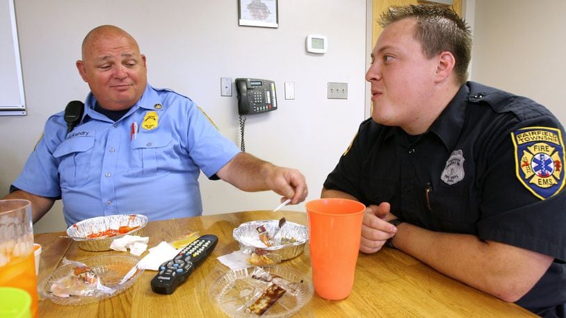 There’s a push by a group of residents to name the Fairfield Twp. park at Millikin and Morris roads in name of former township assistant fire chief Paul McKendry, who died in February 2009. McKendry, at left, is pictured eating lunch with firefighter Jody Asher in September 2007 at the Fairfield Twp. Fire Headquarters. STAFF FILE/2007