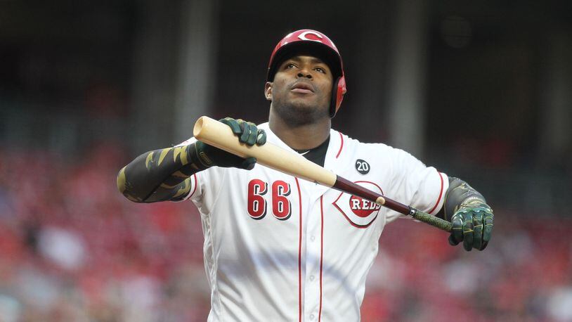 The Reds’ Yasiel Puig reacts after striking out against the Dodgers on Friday, May 17, 2019, at Great American Ball Park in Cincinnati. David Jablonski/Staff