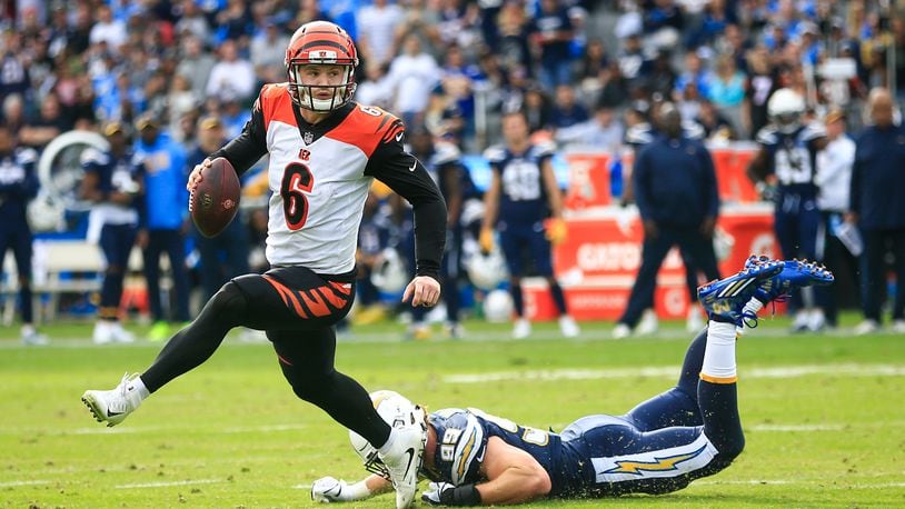 CARSON, CA - DECEMBER 09: Quarterback Jeff Driskel #6 of the Cincinnati Bengals runs a play in front of defensive end Joey Bosa #99 of the Los Angeles Chargers in the second quarter at StubHub Center on December 9, 2018 in Carson, California. (Photo by Sean M. Haffey/Getty Images)