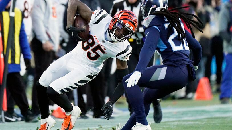 Cincinnati Bengals wide receiver Tee Higgins (85) runs against the Tennessee Titans during the first half of an NFL divisional round playoff football game, Saturday, Jan. 22, 2022, in Nashville, Tenn. (AP Photo/Mark Humphrey)