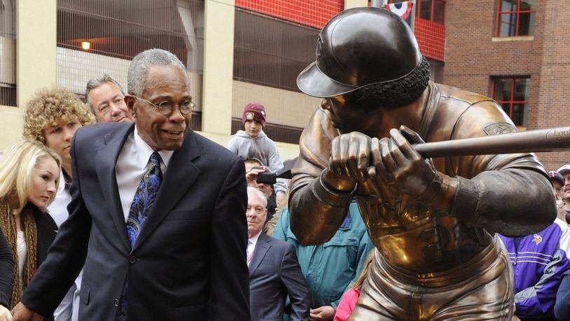 Former Minnesota Twins star Rod Carew admires the sculpture of himself at in the plaza at Target Field in Minneapolis in 2010. (AP Photo/Jim Mone)