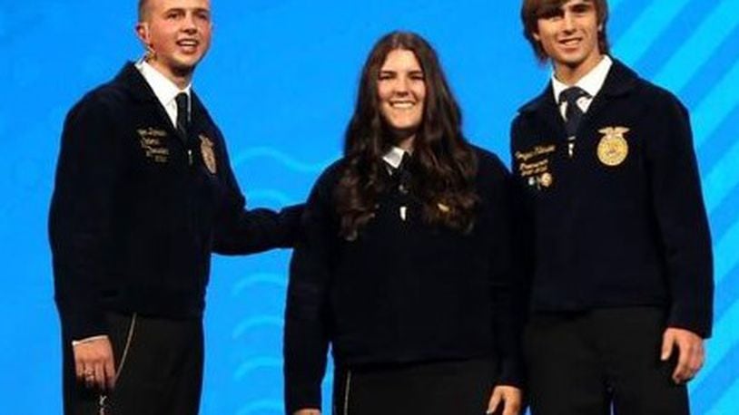 Talawanda FFA Vice President Rachel Dsuban and Treasurer Morgan Gillespie accepted the chapter's National Three Star Award on stage from the National FFA President. CONTRIBUTED
