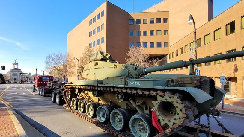 An Army cannon moves through Hamilton on its way to Darrtown for placement at its Veterans Memorial Park. The tank was towed through multiple local areas to get to its final spot. NICK GRAHAM/STAFF