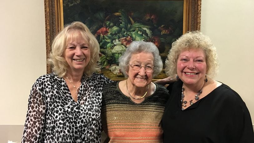 Kathie Bowling, activities assistant at Bradford Place (left) poses with resident Eunice Murphy who is turning 100 on Saturday (center) and Redina Smith, activities director (right).