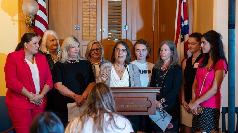 State Senator Nickie J. Antonio, D-Lakewood) center, announces funding for schools to provide period products to girls in grades six to 12. Also pictured are Senator Stephanie Kunze, R-Dublin, (center left) Hamilton County Commissioner Denise Driehaus (center right) and members of the Hamilton County Commission on Women and Girls. Courtesy Nickie J. Antonio.