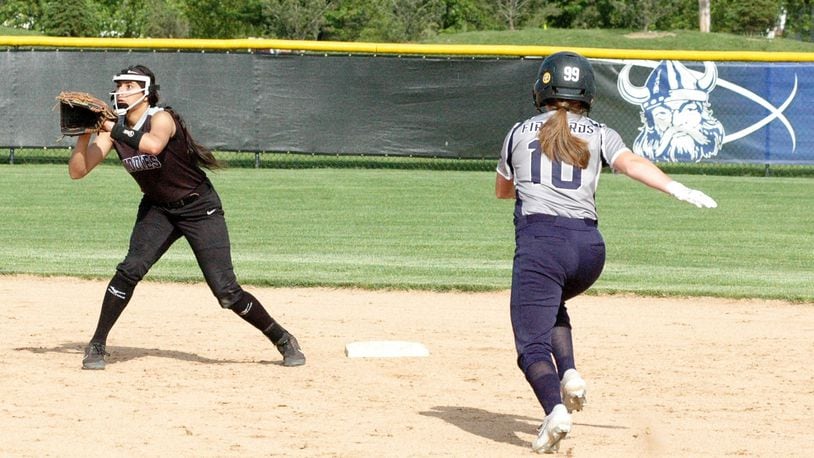 Middletown shortstop Arianna Layne is about to tag out Fairmont’s Taylor Hilty (10) on a steal attempt Tuesday during a Division I district softball semifinal at Miamisburg. Fairmont won 7-2. RICK CASSANO/STAFF