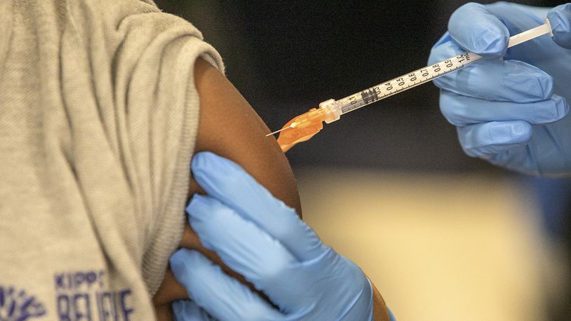 FILE - Medical personnel vaccinate students at a school in New Orleans on Tuesday, Jan. 25, 2022. (AP Photo/Ted Jackson, File)