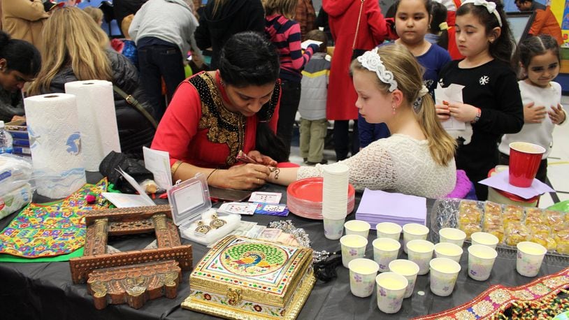 J.F. Burns Elementary School celebrated its diversity with a multicultural fair. At one station, students learned about the Indian body art form Mehndi. CONTRIBUTED