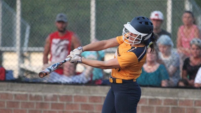 Monroe’s Faith Hensley homers in the final at-bat of her prep career during a Division II district final against Springfield Kenton Ridge on May 20 at Brookville. DAVID JABLONSKI/STAFF