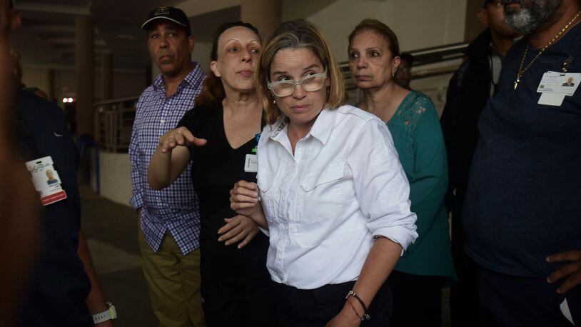 Mayor Carmen Yulin Cruz arrives at San Francisco hospital in Rio Piedras area of San Juan, Puerto Rico, Saturday, Sept. 30, 2017, as about 35 patients are evacuated after the failure of an electrical plant. (AP Photo/Carlos Giusti)