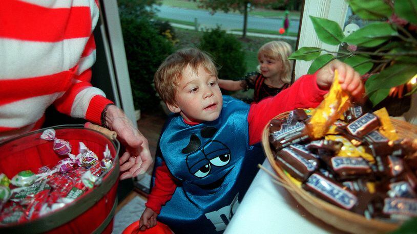 Children pick out Halloween treats. (Palm Beach Post File photo)