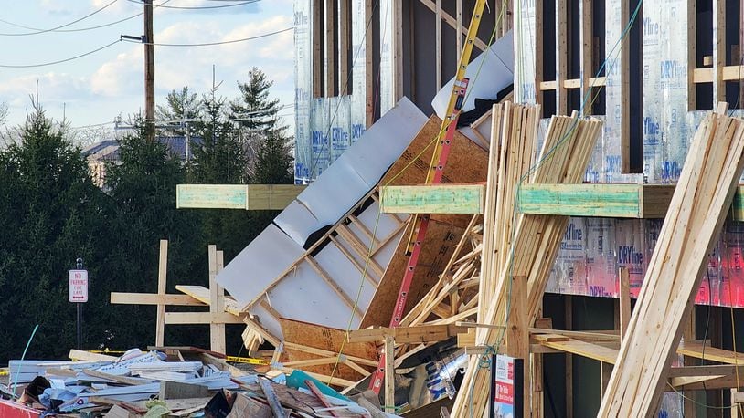 One exterior framed wall of a three-story apartment building on Liberty Way in West Chester Twp. collapsed at around 3 p.m. Jan. 17, 2023, briefly trapping a worker. NICK GRAHAM/STAFF