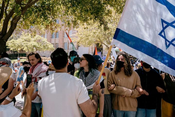 Pro-Israel demonstrators counter-protest near Pro-Palestine demonstrators at the campus of the University of California Los Angeles, on Sunday, April 28, 2024. (Mark Abramson/The New York Times)